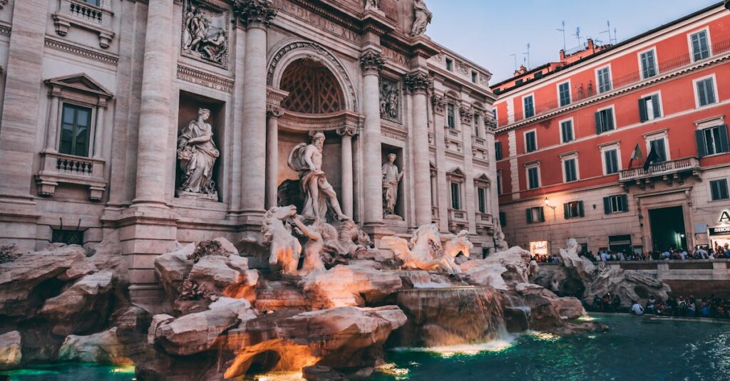The iconic Trevi Fountain in Rome, a masterpiece of Baroque architecture, captured at dusk.